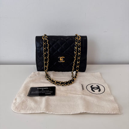 Sac Chanel vintage noir fermoir bicolore