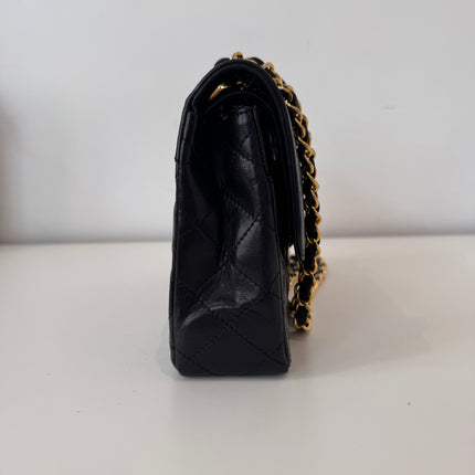 Sac Chanel vintage noir fermoir bicolore