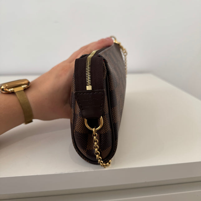 Sac pochette Eva damier ébène