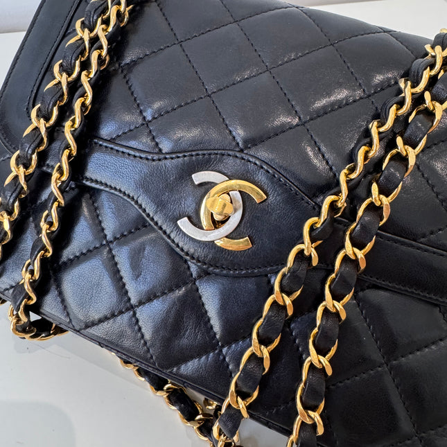 Sac Chanel vintage noir fermoir bicolore