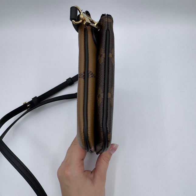 Pochette double zip Louis Vuitton