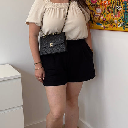 Sac Chanel vintage noir fermoir bicolore