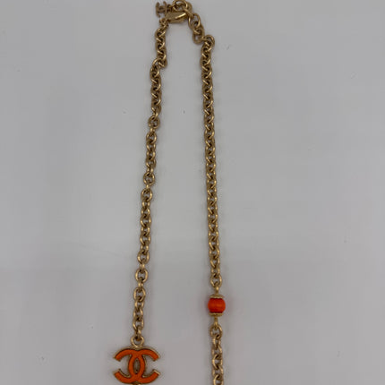 Sautoir Chanel double C doré et orange