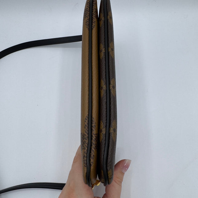 Pochette double zip Louis Vuitton