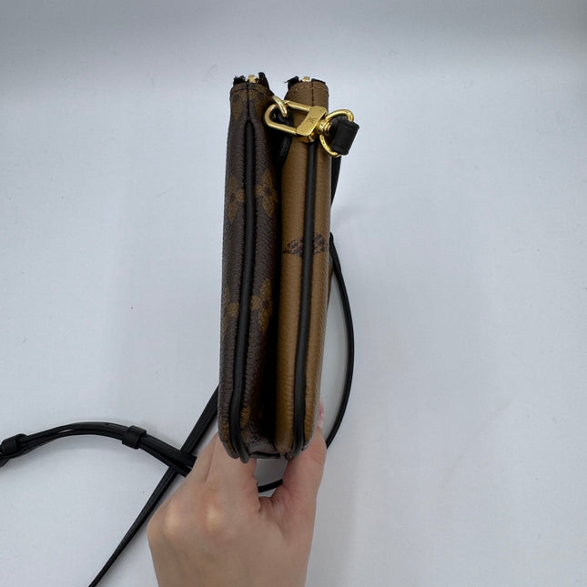 Pochette double zip Louis Vuitton