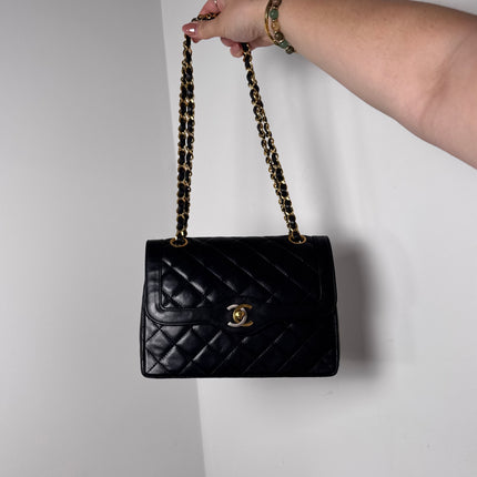Sac Chanel vintage noir fermoir bicolore